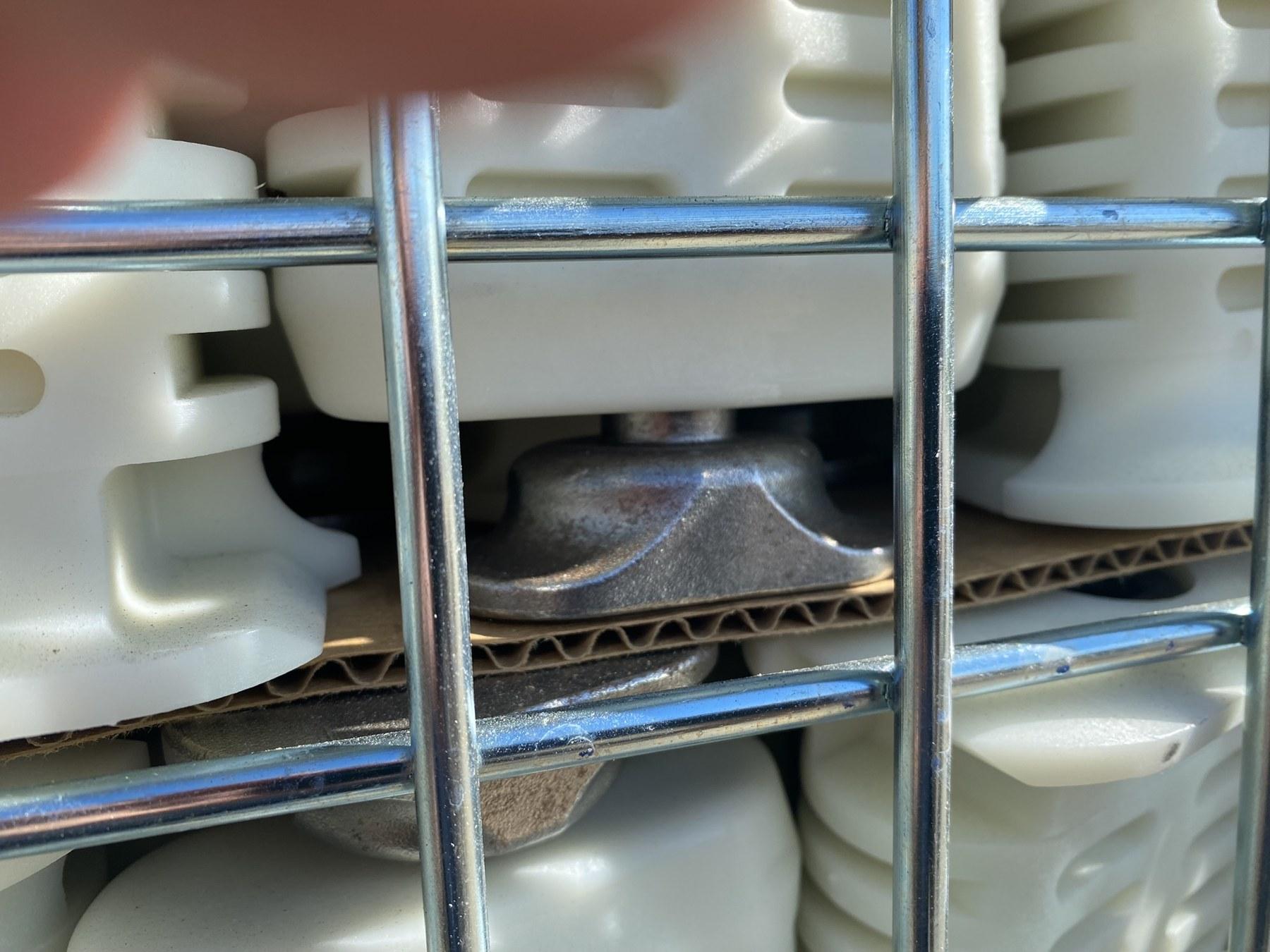Metal basket filled with locking pins for field installation