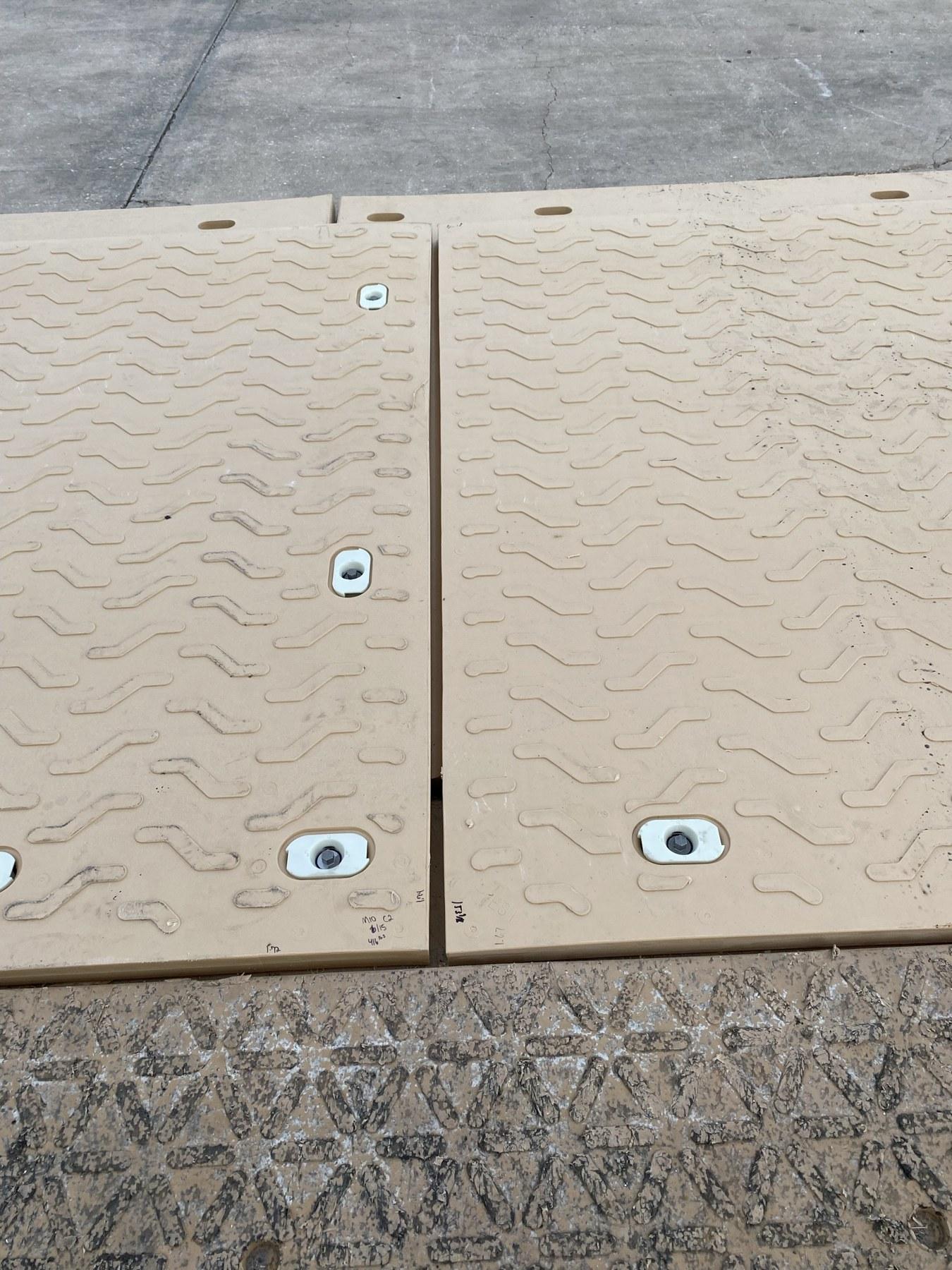 Composite mats connected with locking pins set in recessed pockets