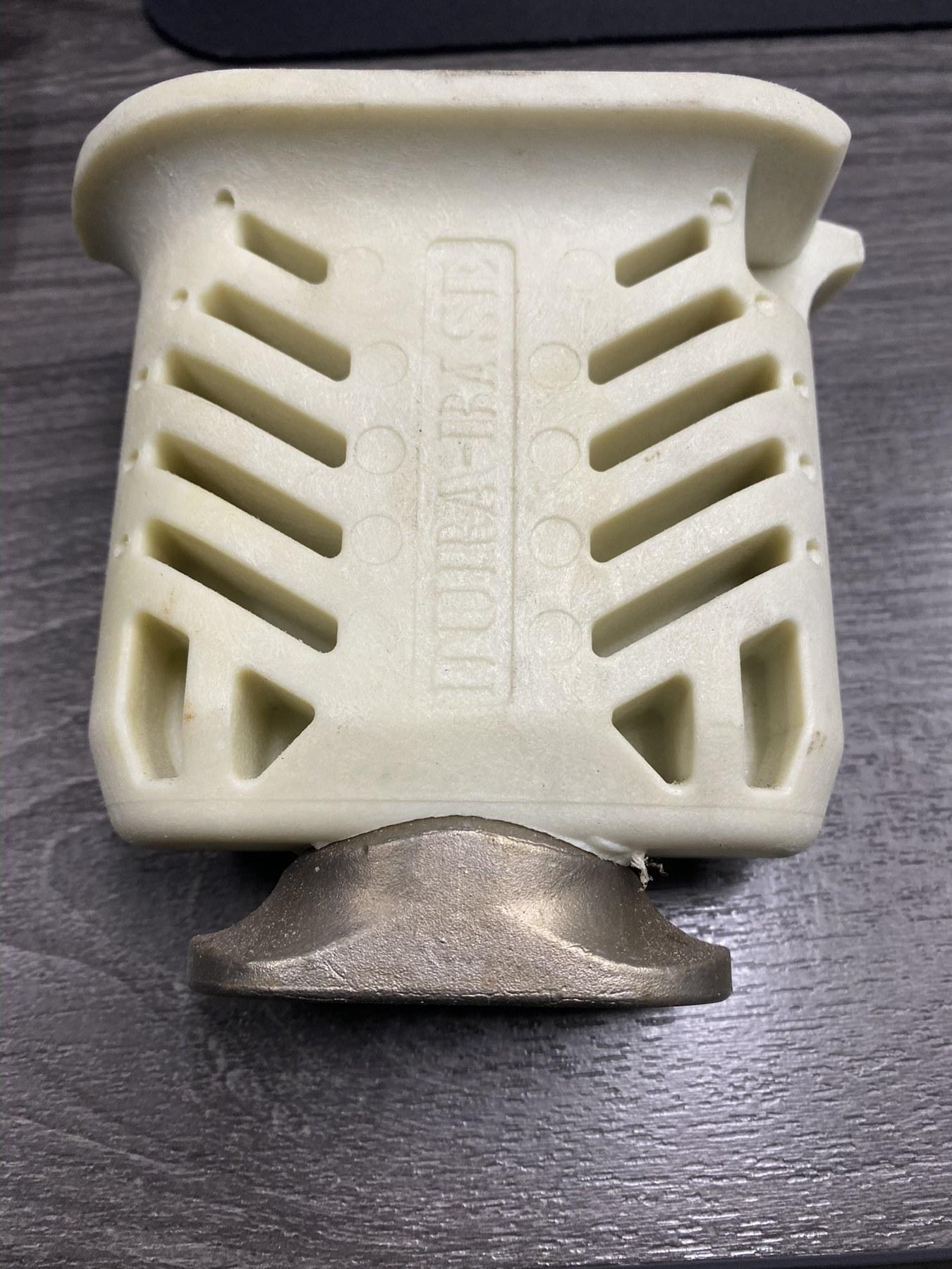 Cutaway of the revised locking-pin body and internal metal component
