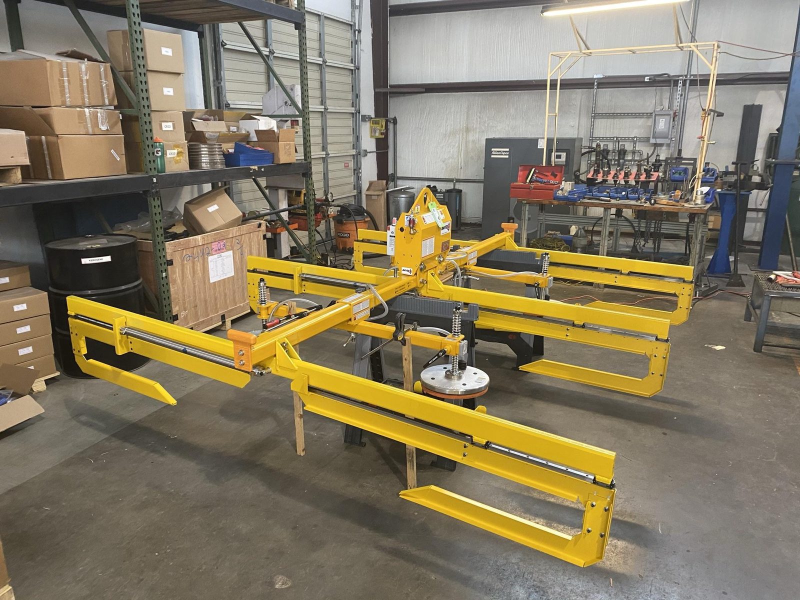 Purpose-built end effector for handling a large molded composite mat